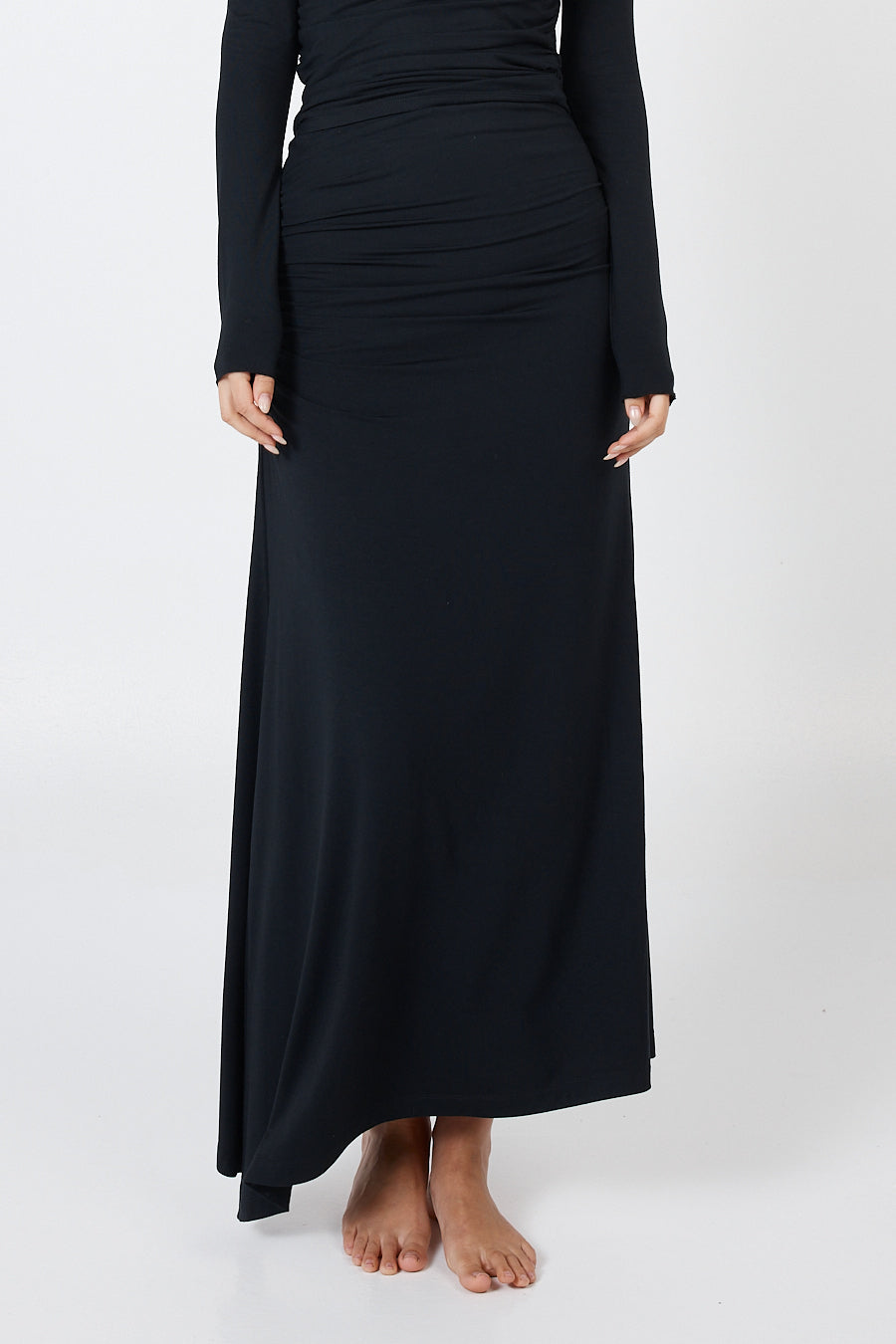 Soft, cosy floor-length skirt with a high waist and asymmetric hem, designed to create an elongating silhouette. A versatile and comfortable wardrobe essential, perfect for effortless day-to-night dressing.