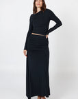 Soft, cosy floor-length skirt with a high waist and asymmetric hem, designed to create an elongating silhouette. A versatile and comfortable wardrobe essential, perfect for effortless day-to-night dressing.