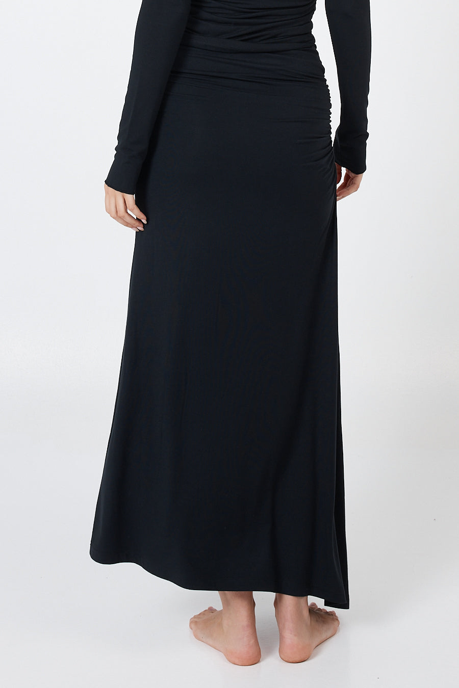 Soft, cosy floor-length skirt with a high waist and asymmetric hem, designed to create an elongating silhouette. A versatile and comfortable wardrobe essential, perfect for effortless day-to-night dressing.