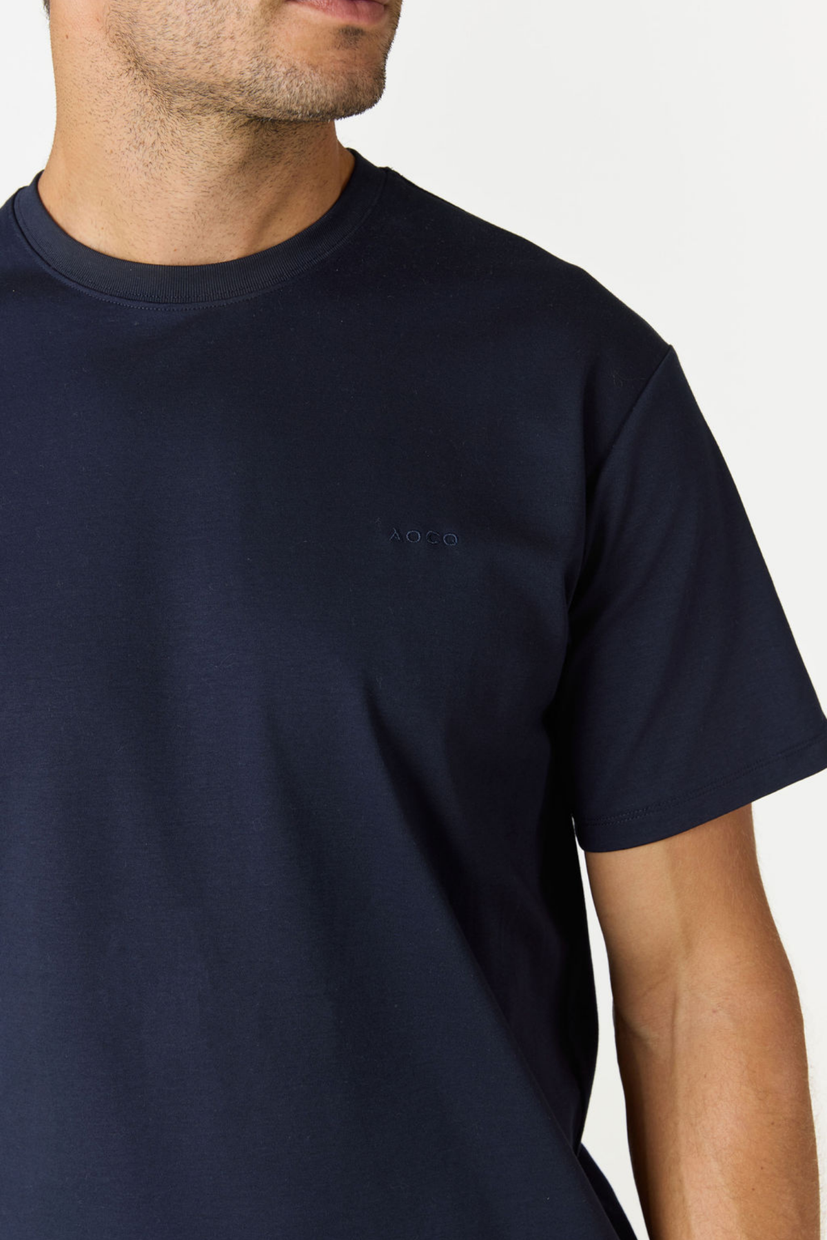 Elevate your everyday basics with the Logo Embroidered Cotton T-shirt from AOCO. Made from premium, breathable cotton, it features a timeless minimalist logo.