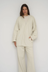Wrap yourself in comfort with the French Terry Robe Jacket from AOCO. This versatile layer blends robe-like coziness with an everyday stylish jacket design.