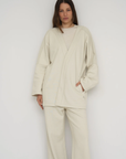 Wrap yourself in comfort with the French Terry Robe Jacket from AOCO. This versatile layer blends robe-like coziness with an everyday stylish jacket design.