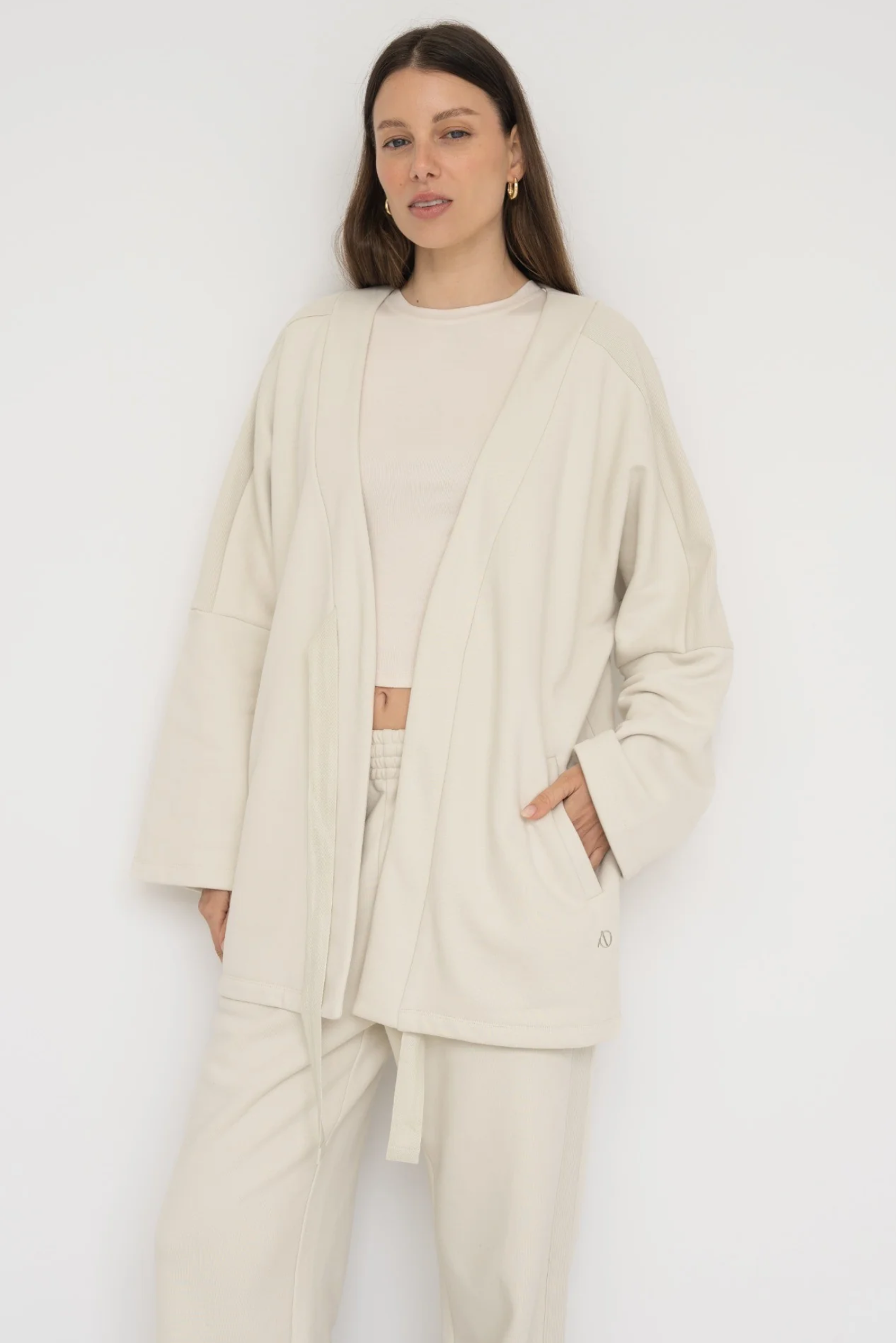 Wrap yourself in comfort with the French Terry Robe Jacket from AOCO. This versatile layer blends robe-like coziness with an everyday stylish jacket design.