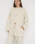 Wrap yourself in comfort with the French Terry Robe Jacket from AOCO. This versatile layer blends robe-like coziness with an everyday stylish jacket design.