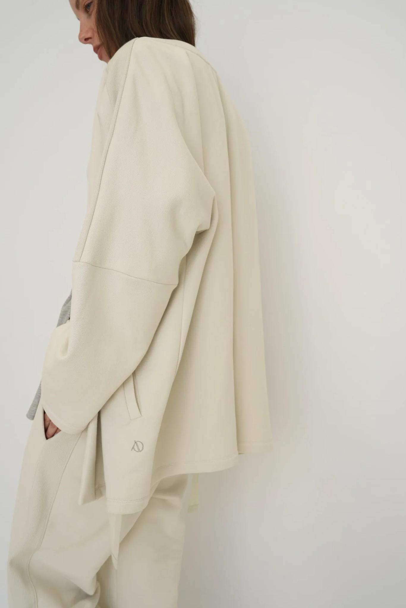 Wrap yourself in comfort with the French Terry Robe Jacket from AOCO. This versatile layer blends robe-like coziness with an everyday stylish jacket design.