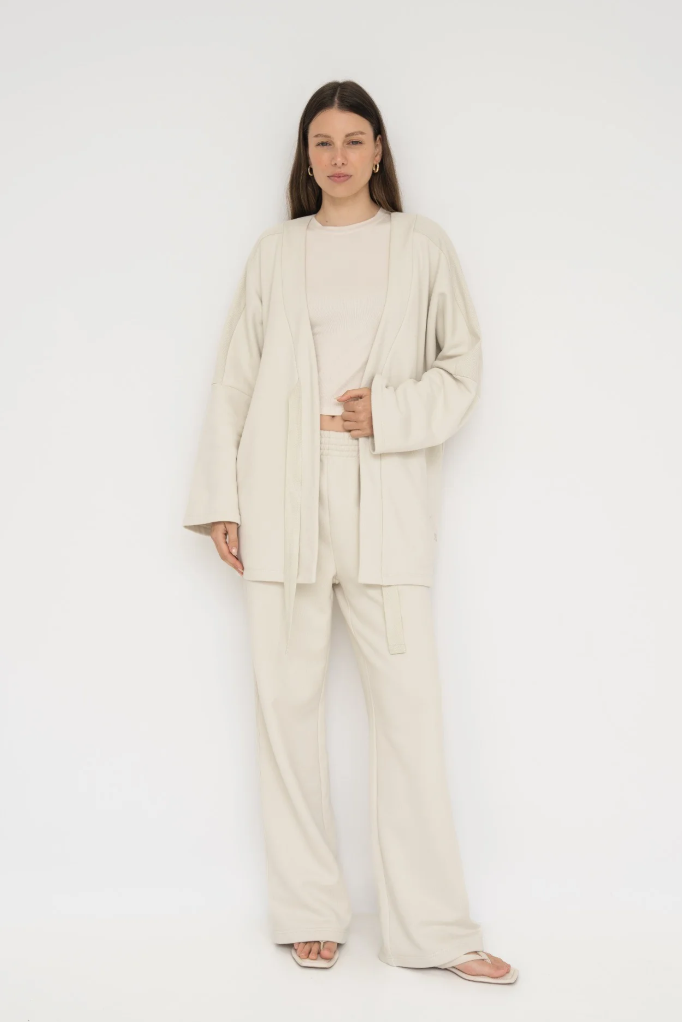 Wrap yourself in comfort with the French Terry Robe Jacket from AOCO. This versatile layer blends robe-like coziness with an everyday stylish jacket design.