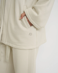 Wrap yourself in comfort with the French Terry Robe Jacket from AOCO. This versatile layer blends robe-like coziness with an everyday stylish jacket design.