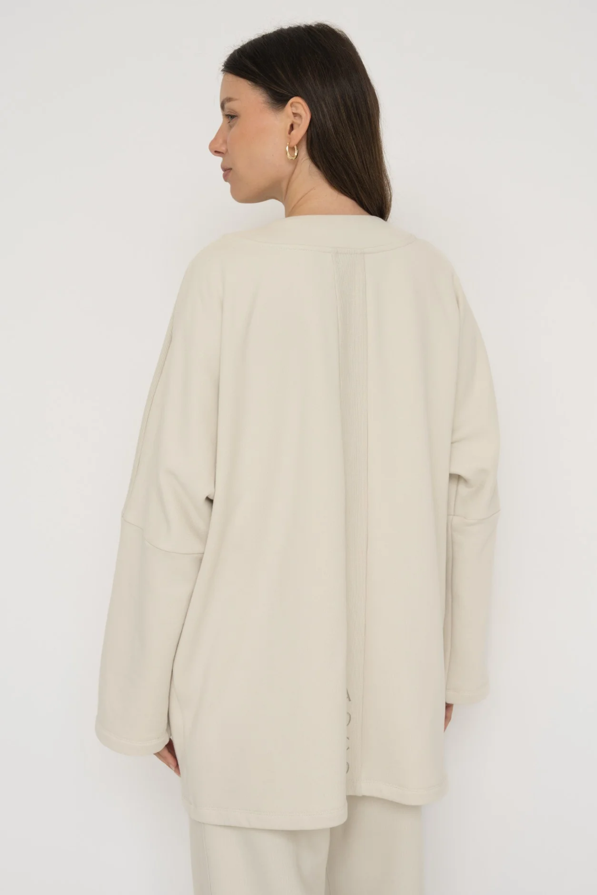 Wrap yourself in comfort with the French Terry Robe Jacket from AOCO. This versatile layer blends robe-like coziness with an everyday stylish jacket design.