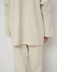 Wrap yourself in comfort with the French Terry Robe Jacket from AOCO. This versatile layer blends robe-like coziness with an everyday stylish jacket design.