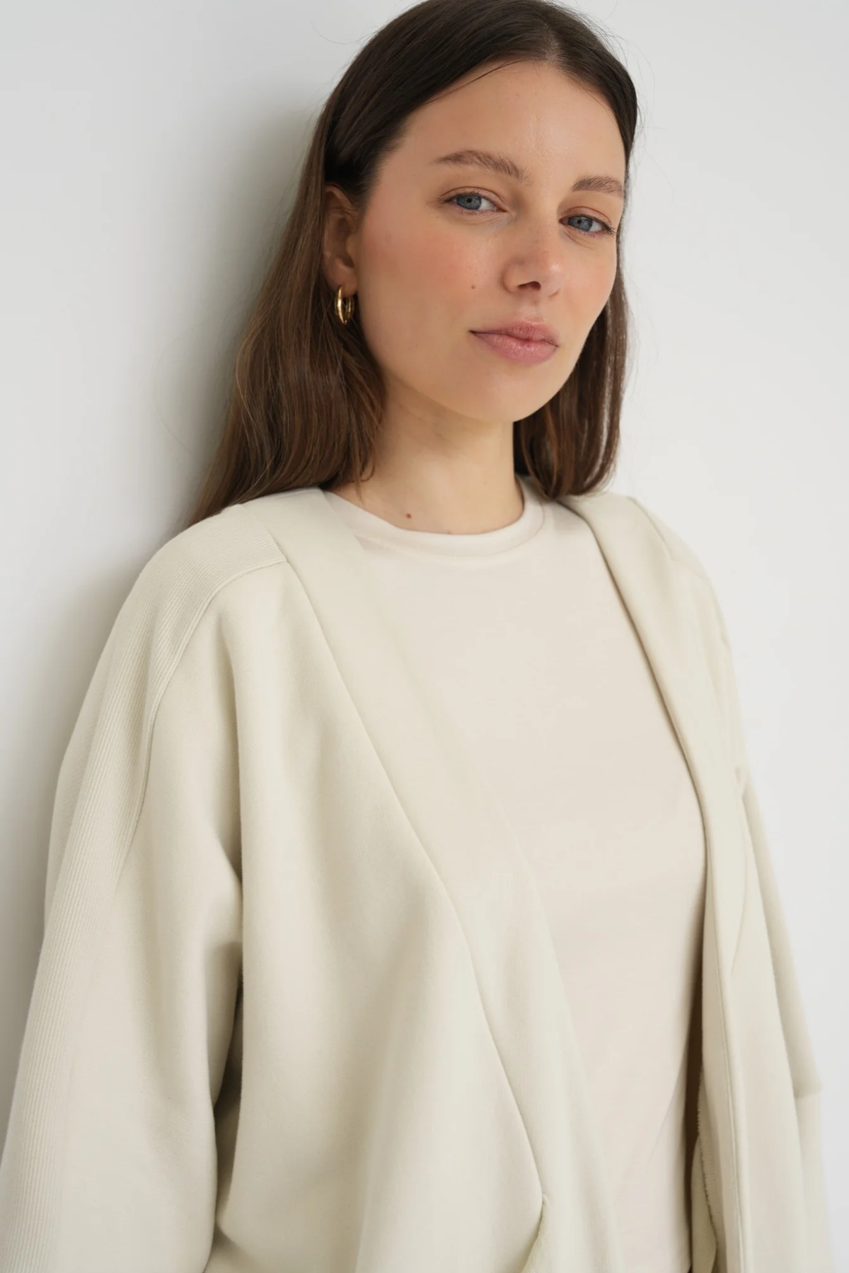 Wrap yourself in comfort with the French Terry Robe Jacket from AOCO. This versatile layer blends robe-like coziness with an everyday stylish jacket design.