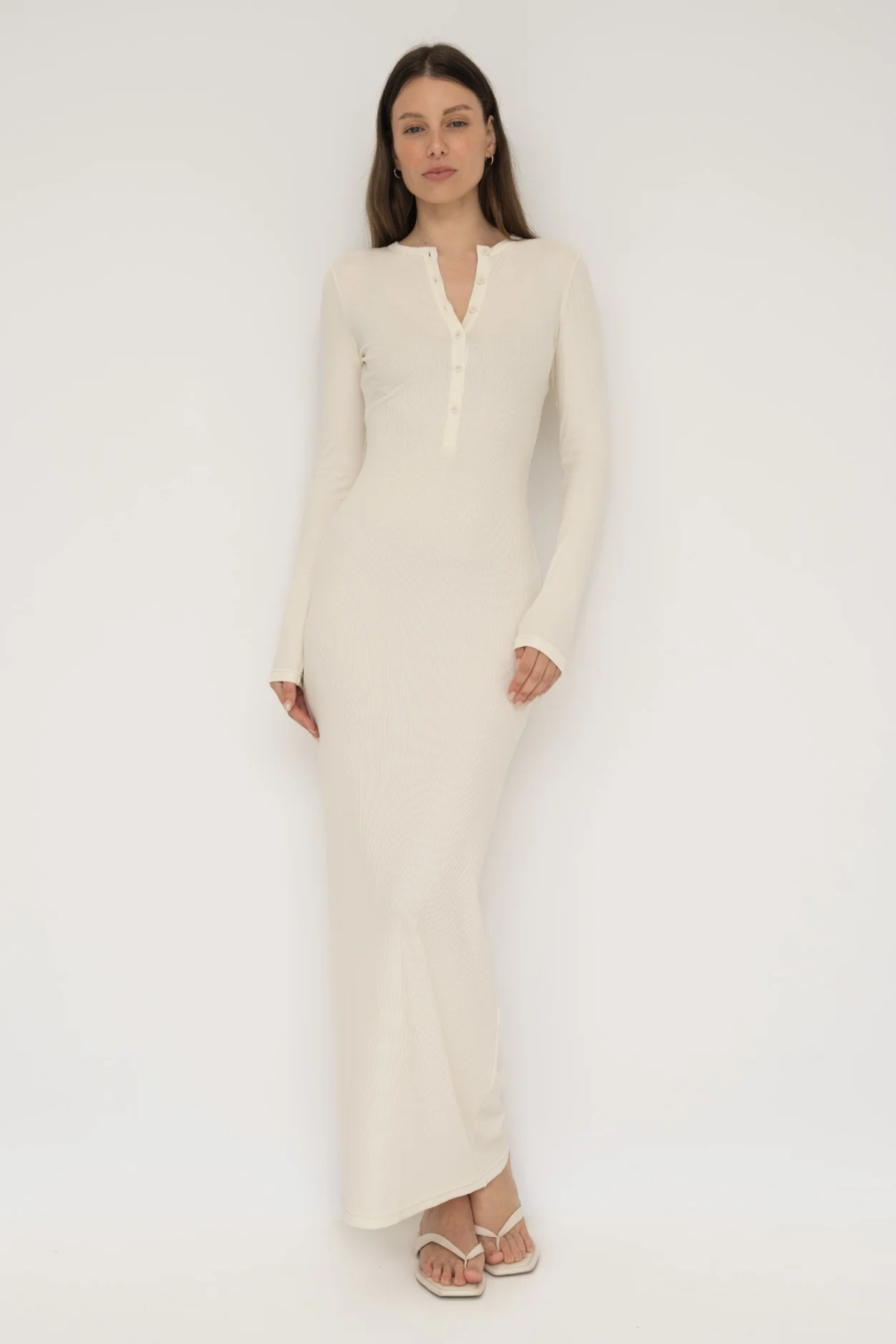 Embrace effortless style with the Long Sleeve Henley Maxi Dress from AOCO. Featuring a classic button front and soft fabrics, it's your new daily essential.