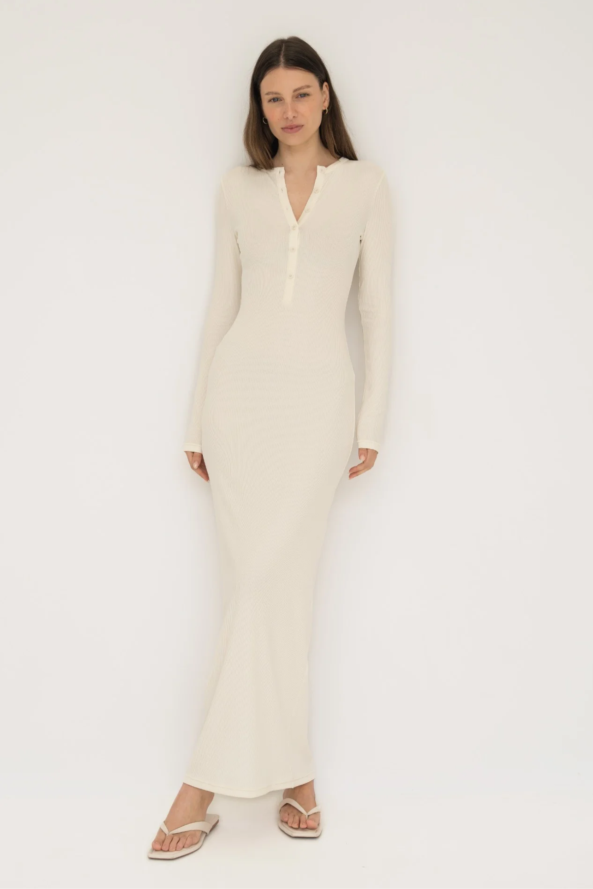 Embrace effortless style with the Long Sleeve Henley Maxi Dress from AOCO. Featuring a classic button front and soft fabrics, it's your new daily essential.