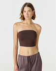 Elevate your warm-weather wardrobe with the Edie Bandeau Top from AOCO. This chic strapless design offers a flattering fit and endless style possibilities.