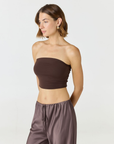 Elevate your warm-weather wardrobe with the Edie Bandeau Top in Espresso from AOCO. This chic strapless design offers a flattering fit and endless style possibilities.