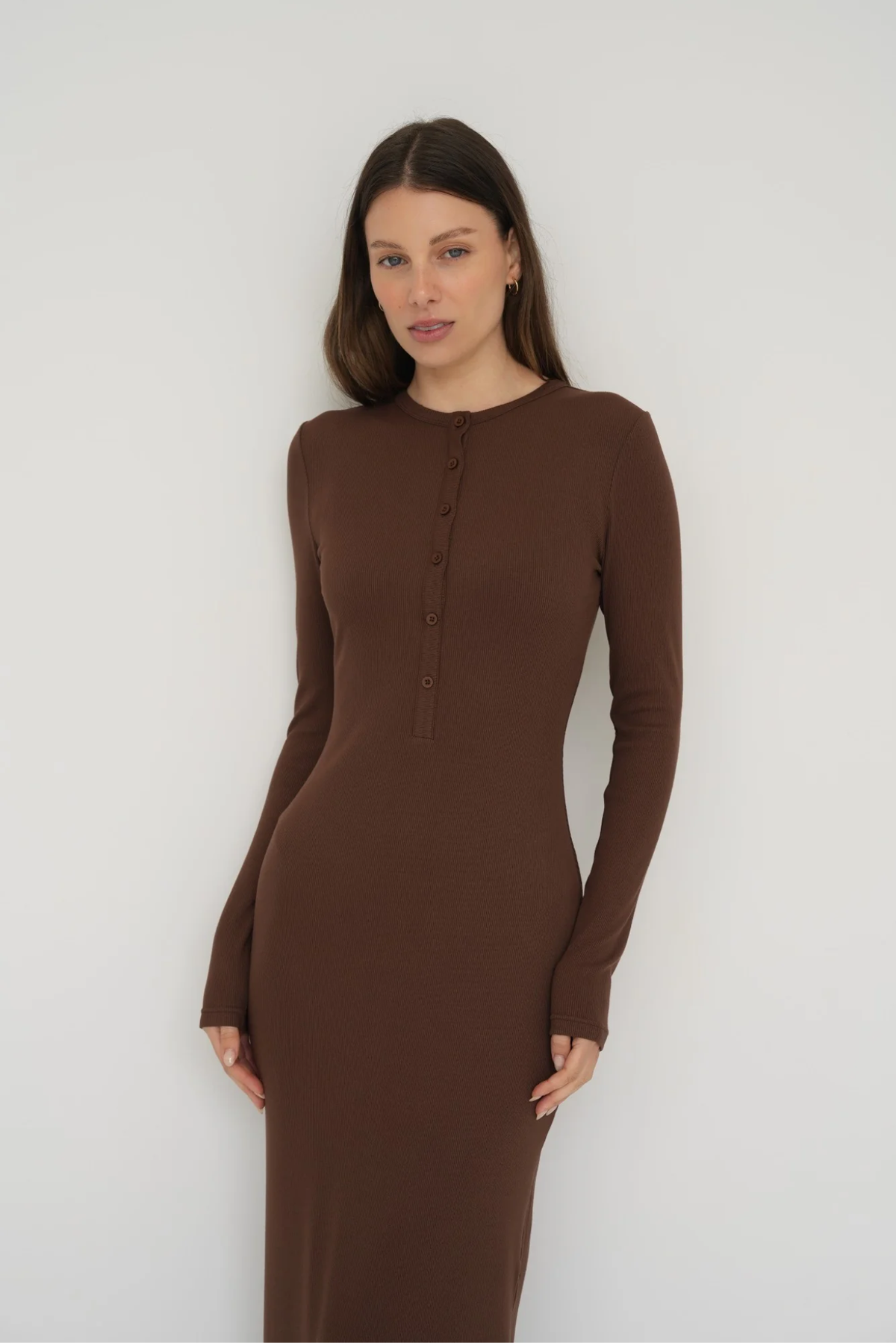 Embrace effortless style with the Long Sleeve Henley Maxi Dress from AOCO. Featuring a classic button front and soft fabrics, it's your new daily essential.