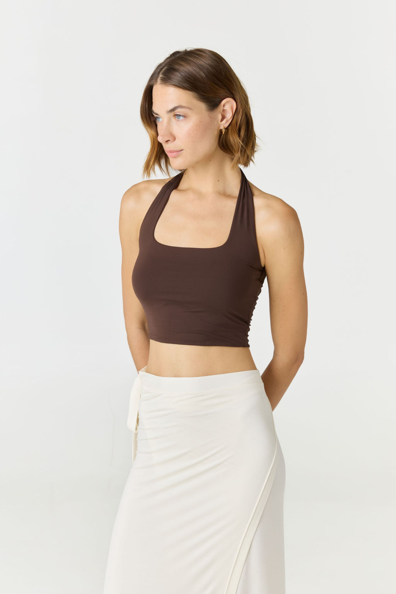 Refresh your summer wardrobe with the Mia Cropped Halter from AOCO. Featuring a chic halter neckline and a flattering cropped fit, it's a warm weather must.