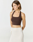 Refresh your summer wardrobe with the Mia Cropped Halter from AOCO. Featuring a chic halter neckline and a flattering cropped fit, it's a warm weather must.