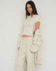 Upgrade your downtime with the French Terry Wide Leg Pants from AOCO in cream. Crafted from ultra-soft fabrics, these chic bottoms provide a flattering, relaxed fit.