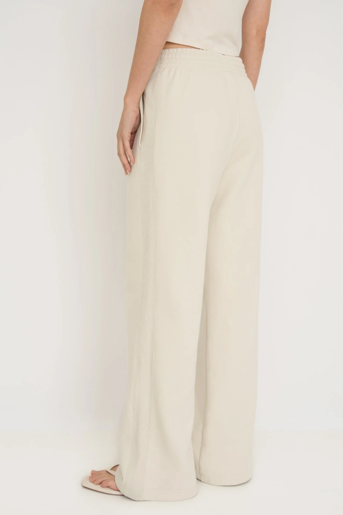 Upgrade your downtime with the French Terry Wide Leg Pants from AOCO in cream. Crafted from ultra-soft fabrics, these chic bottoms provide a flattering, relaxed fit.
