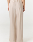 Crafted in premium silk, these straight leg pants Champagne / light beige silk pants move with a fluid drape and understated structure. A considered staple that balances ease and refinement for effortless everyday dressing. Pair with the Anaiis Silk Tank for an elevated set. 