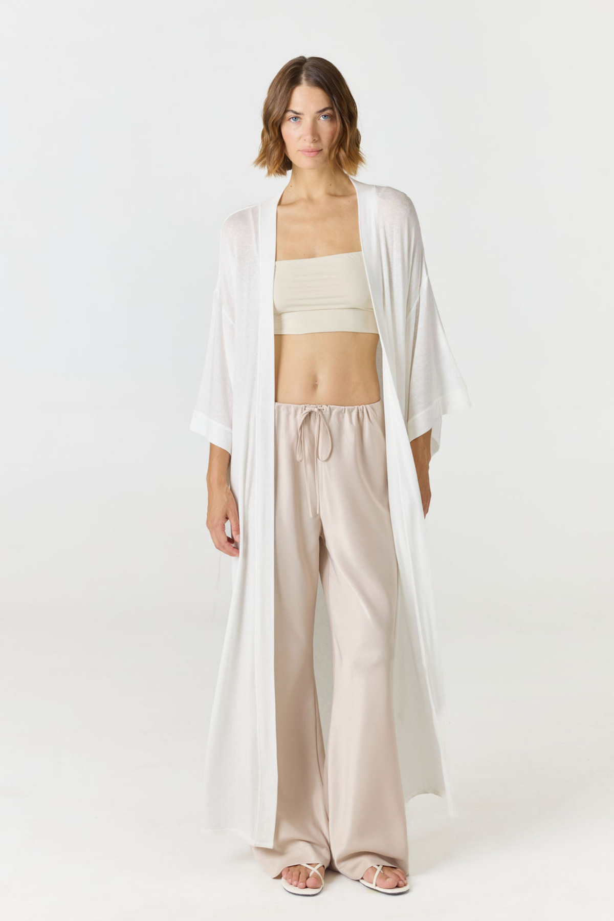 Crafted in premium silk, these straight leg pants Champagne / light beige silk pants move with a fluid drape and understated structure. A considered staple that balances ease and refinement for effortless everyday dressing. Pair with the Anaiis Silk Tank for an elevated set. 
