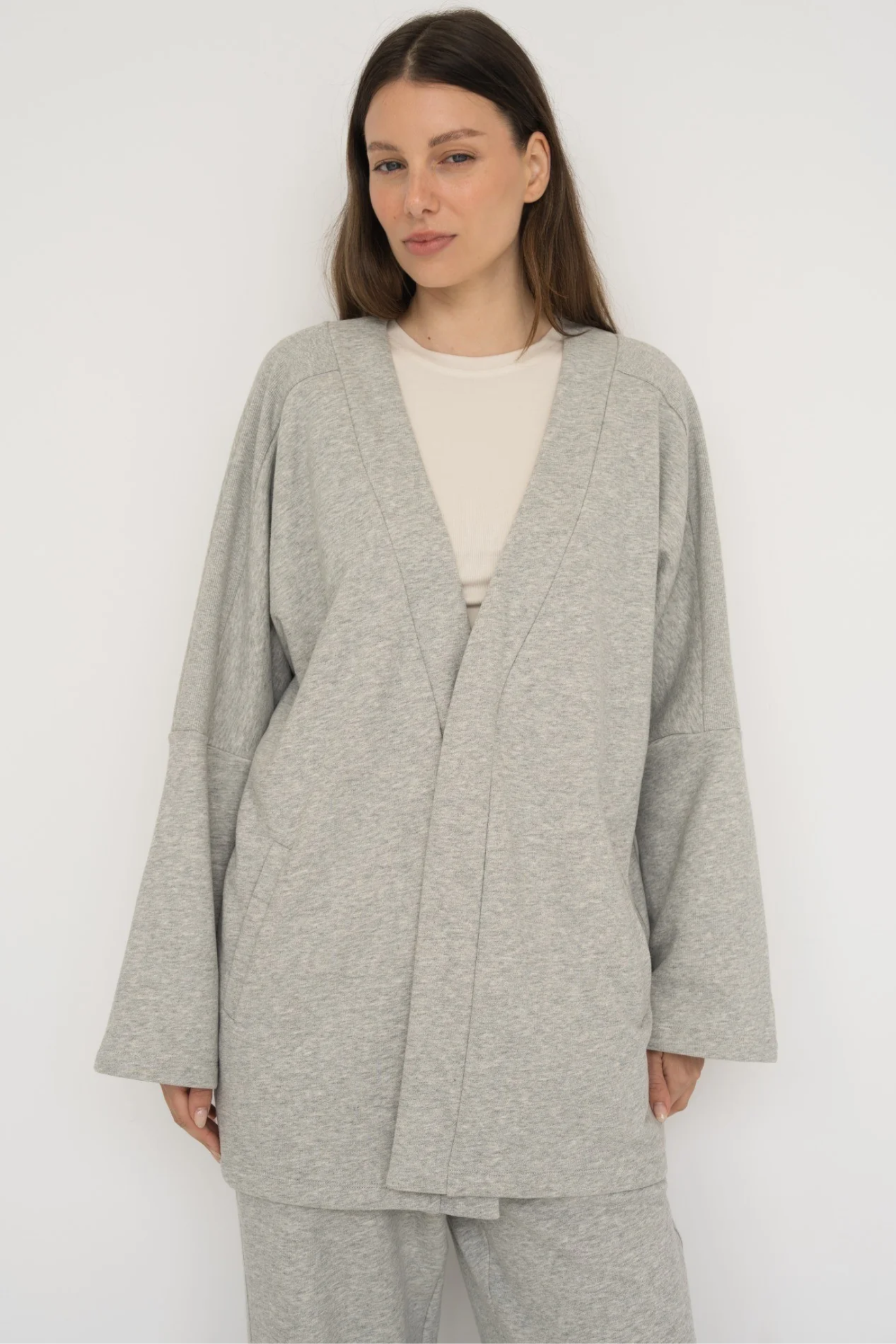 Wrap yourself in comfort with the French Terry Robe Jacket from AOCO. This versatile layer blends robe-like coziness with an everyday stylish jacket design.
