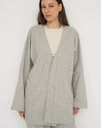 Wrap yourself in comfort with the French Terry Robe Jacket from AOCO. This versatile layer blends robe-like coziness with an everyday stylish jacket design.