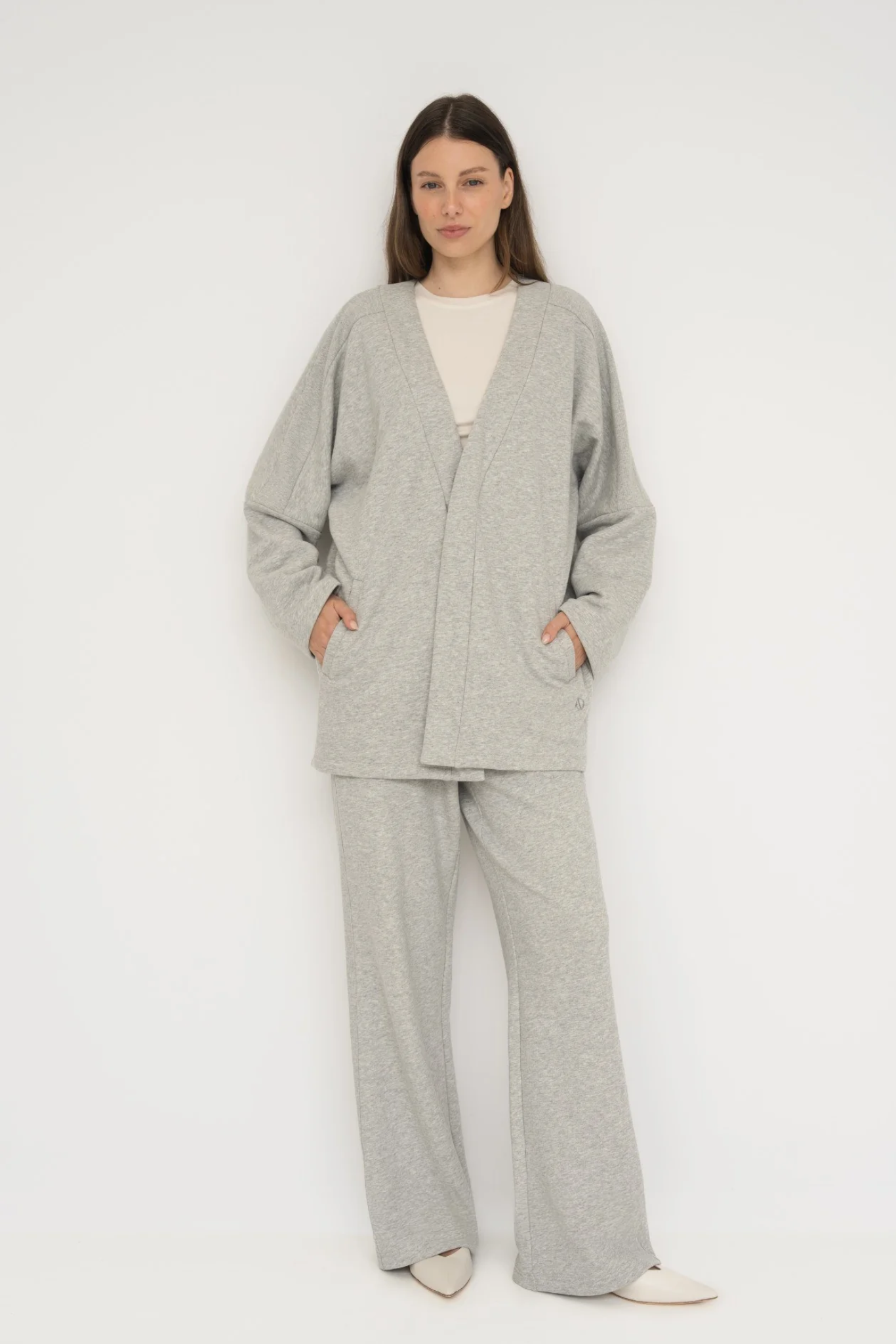 Wrap yourself in comfort with the French Terry Robe Jacket from AOCO. This versatile layer blends robe-like coziness with an everyday stylish jacket design.