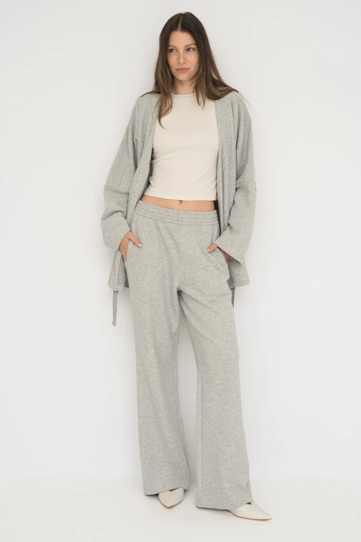 Wrap yourself in comfort with the French Terry Robe Jacket from AOCO. This versatile layer blends robe-like coziness with an everyday stylish jacket design.
