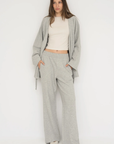 Wrap yourself in comfort with the French Terry Robe Jacket from AOCO. This versatile layer blends robe-like coziness with an everyday stylish jacket design.