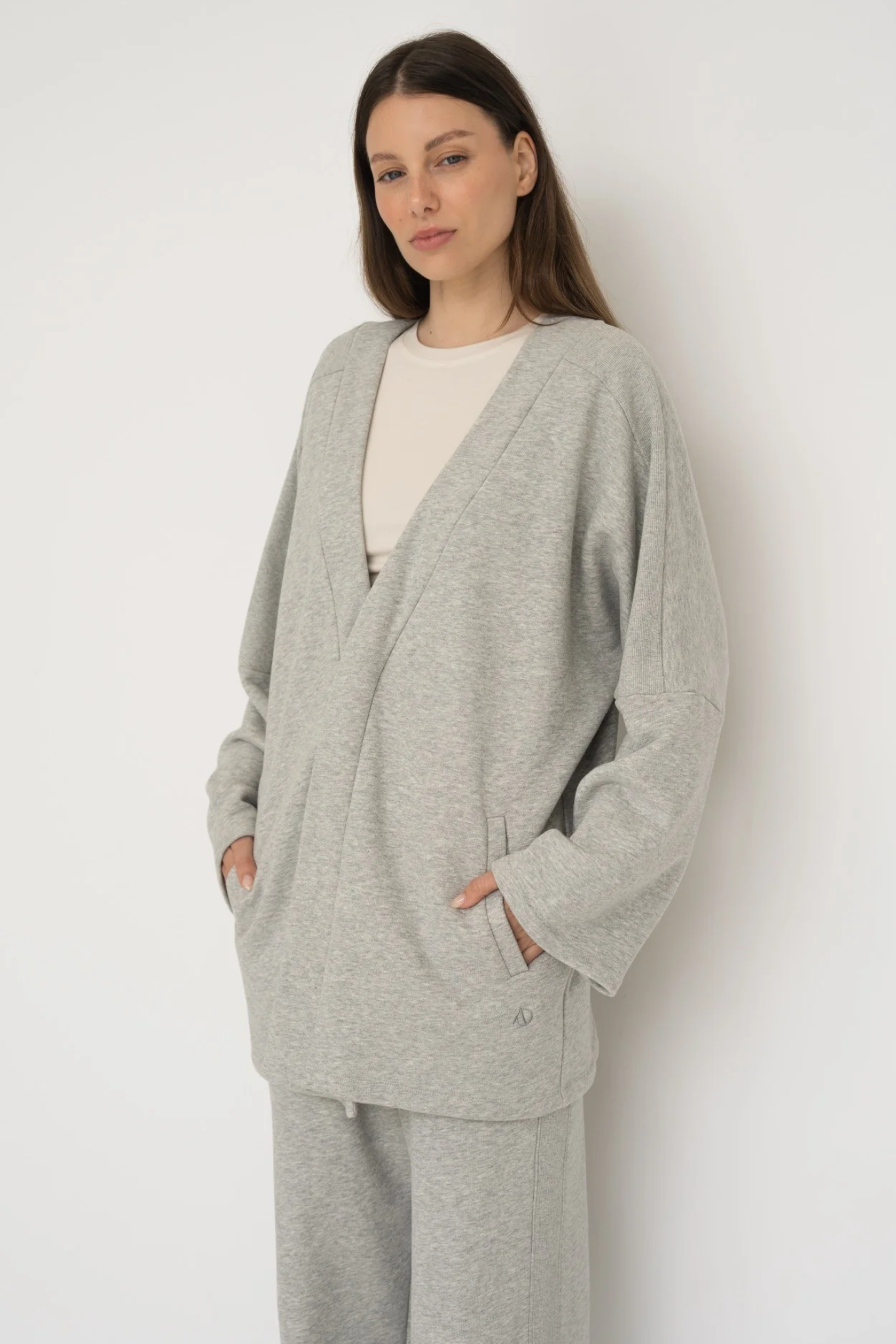 Wrap yourself in comfort with the French Terry Robe Jacket from AOCO. This versatile layer blends robe-like coziness with an everyday stylish jacket design.