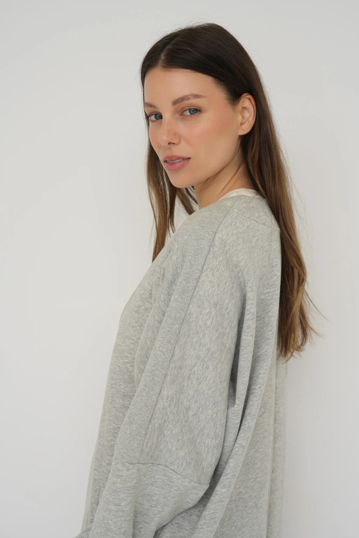 Wrap yourself in comfort with the French Terry Robe Jacket from AOCO. This versatile layer blends robe-like coziness with an everyday stylish jacket design.