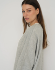 Wrap yourself in comfort with the French Terry Robe Jacket from AOCO. This versatile layer blends robe-like coziness with an everyday stylish jacket design.