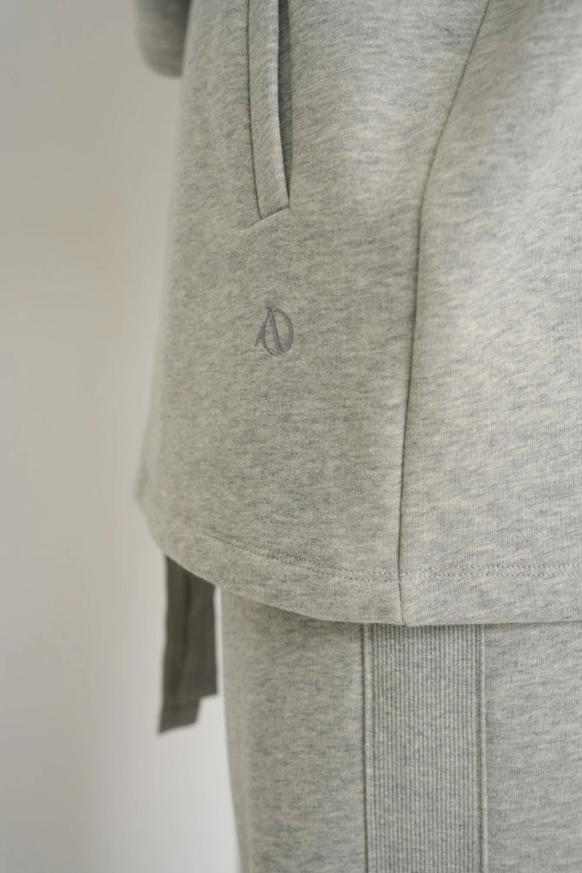 Wrap yourself in comfort with the French Terry Robe Jacket from AOCO. This versatile layer blends robe-like coziness with an everyday stylish jacket design.