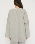 Wrap yourself in comfort with the French Terry Robe Jacket from AOCO. This versatile layer blends robe-like coziness with an everyday stylish jacket design.