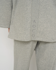 Wrap yourself in comfort with the French Terry Robe Jacket from AOCO. This versatile layer blends robe-like coziness with an everyday stylish jacket design.