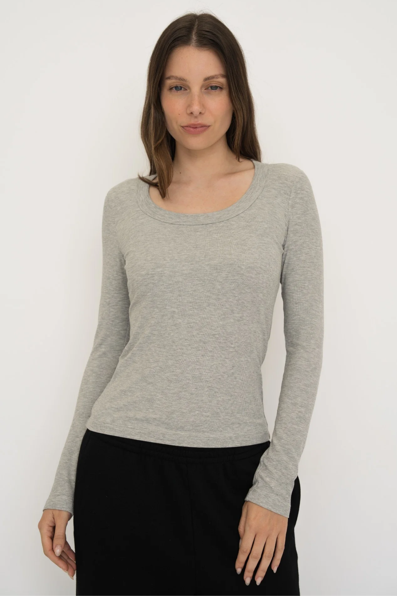 Upgrade your basics with the Long Sleeve Fitted Scoop Neck Top by AOCO. Made from soft, stretchy fabric, this flattering silhouette is a daily essential.
