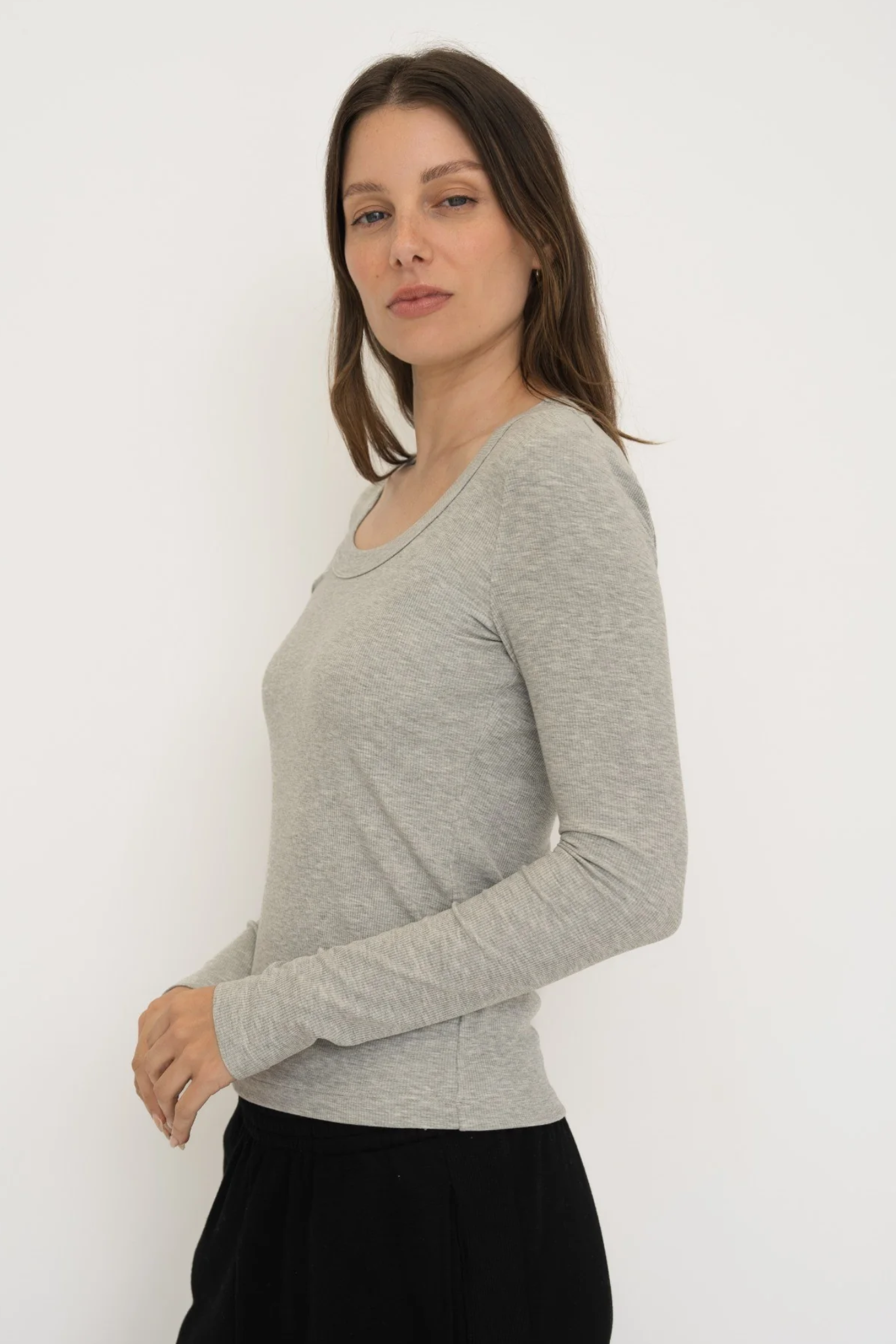 Upgrade your basics with the Long Sleeve Fitted Scoop Neck Top by AOCO. Made from soft, stretchy fabric, this flattering silhouette is a daily essential.