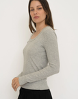 Upgrade your basics with the Long Sleeve Fitted Scoop Neck Top by AOCO. Made from soft, stretchy fabric, this flattering silhouette is a daily essential.