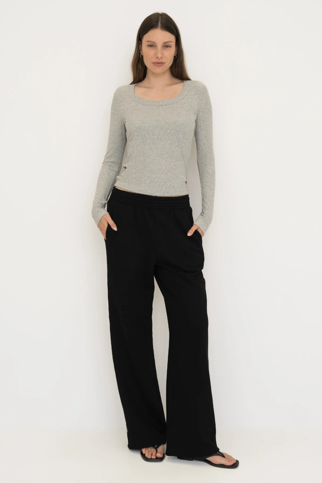 Upgrade your basics with the Long Sleeve Fitted Scoop Neck Top by AOCO. Made from soft, stretchy fabric, this flattering silhouette is a daily essential.