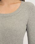 Upgrade your basics with the Long Sleeve Fitted Scoop Neck Top by AOCO. Made from soft, stretchy fabric, this flattering silhouette is a daily essential.