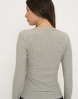 Upgrade your basics with the Long Sleeve Fitted Scoop Neck Top by AOCO. Made from soft, stretchy fabric, this flattering silhouette is a daily essential.