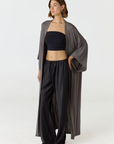 Relax in luxury with the Shura Kaftan from AOCO. This breezy, lightweight resort wear piece features an elegant, relaxed fit perfect for your next getaway.