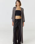 Relax in luxury with the Shura Kaftan from AOCO. This breezy, lightweight resort wear piece features an elegant, relaxed fit perfect for your next getaway.