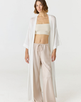 Relax in luxury with the Shura Kaftan from AOCO. This breezy, lightweight resort wear piece features an elegant, relaxed fit perfect for your next getaway.