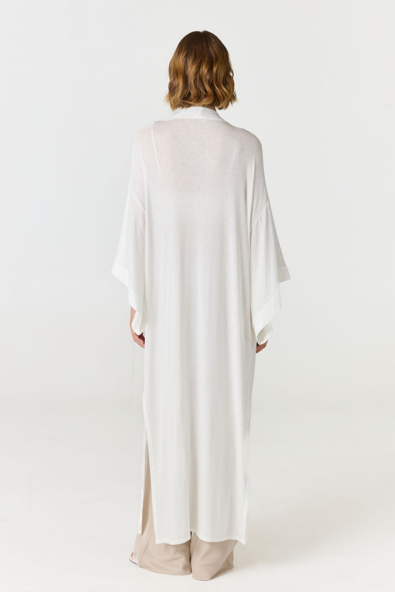 Relax in luxury with the Shura Kaftan from AOCO. This breezy, lightweight resort wear piece features an elegant, relaxed fit perfect for your next getaway.
