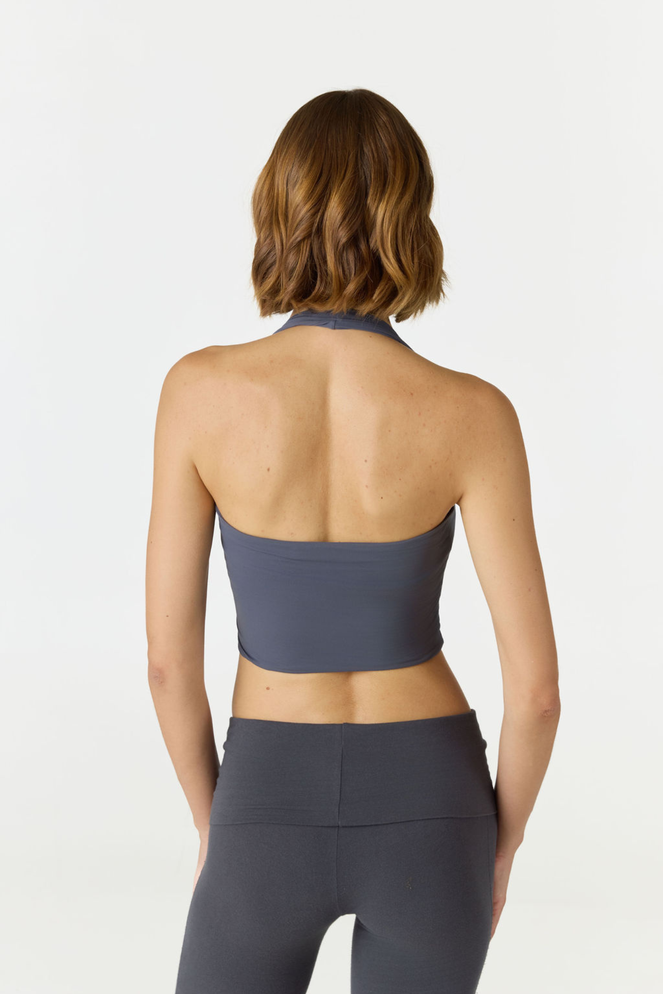 Refresh your summer wardrobe with the Mia Cropped Halter from AOCO. Featuring a chic halter neckline and a flattering cropped fit, it's a warm weather must.