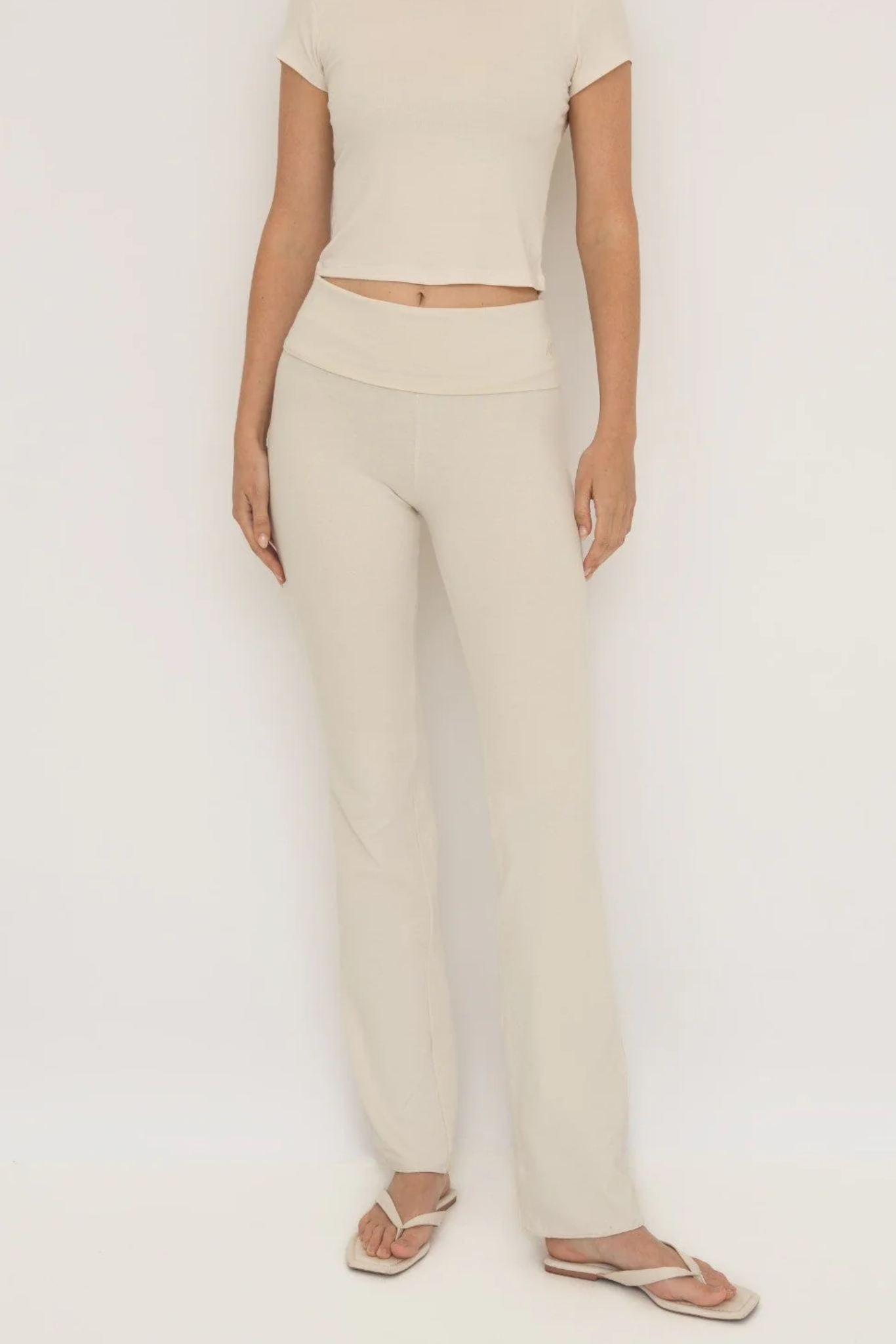 Soft organic cotton fold over leggings in cream with a comfortable fold over waistband.