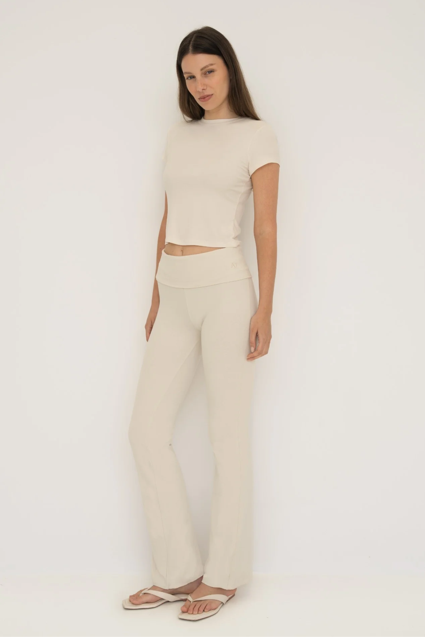 Soft organic cotton fold over leggings in cream with a comfortable fold over waistband.