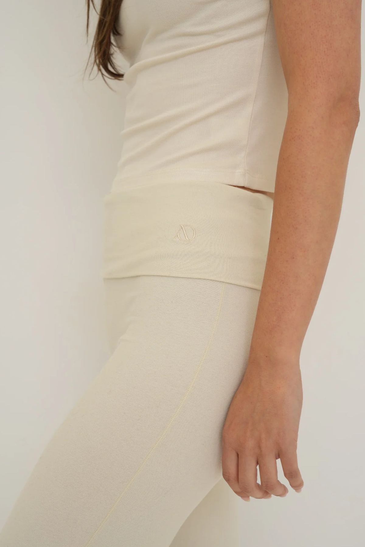 Soft organic cotton fold over leggings in cream with a comfortable fold over waistband.